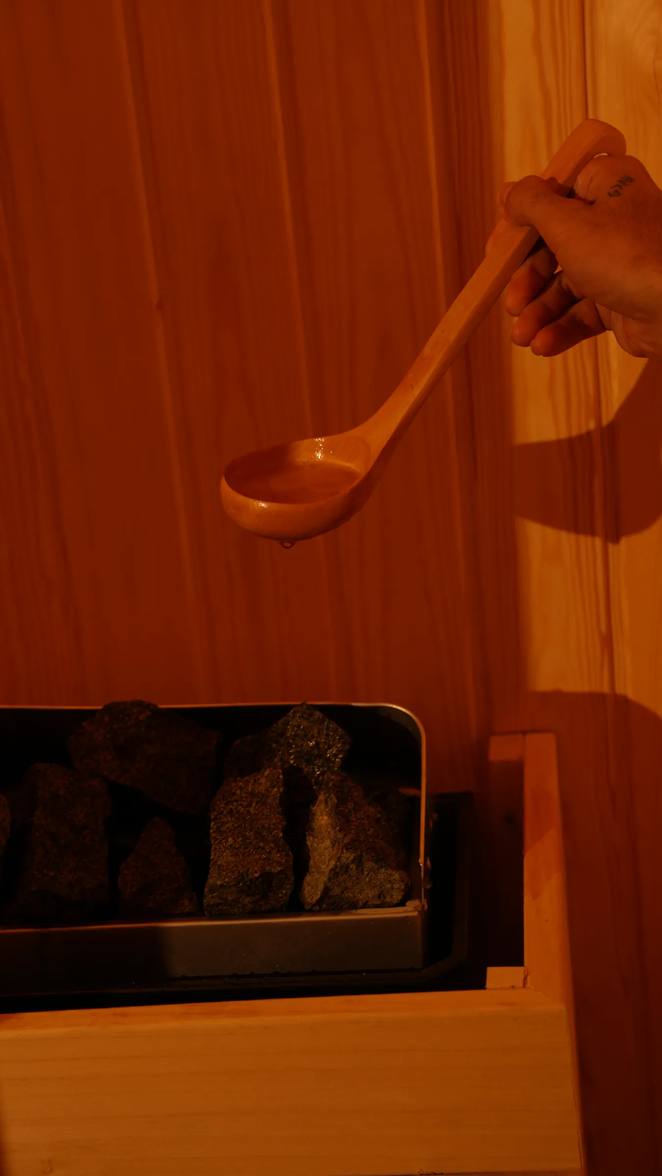 Water poured over the hot stones in O'SPA Sky's sauna
